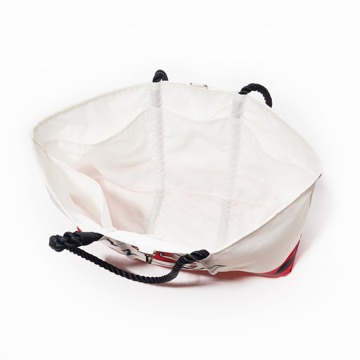 Kansas City Chiefs Tailgate Tote by Sea Bags made from white recycled sail cloth with black rope handles, open to reveal a spacious interior and side pocket, viewed from above on a white background. by Sea Bags