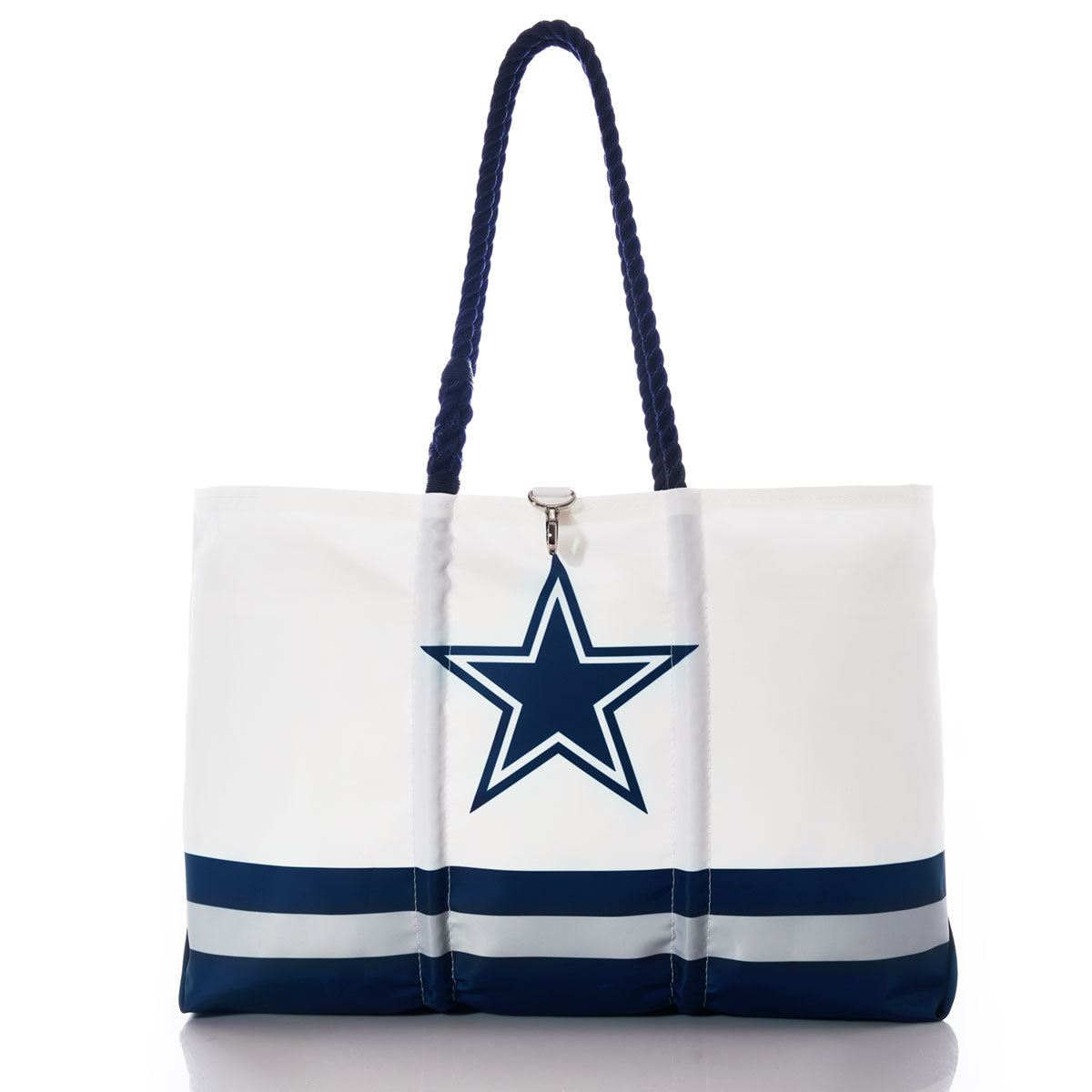 The Dallas Cowboys Tailgate Tote by Sea Bags features navy blue handles, a large blue star logo in the center, and blue and gray horizontal stripes near the bottom—a recycled sail cloth bag that’s perfect for any football fan or Dallas Cowboys tote collection. by Sea Bags