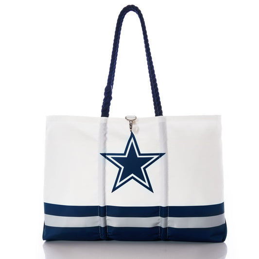 The Dallas Cowboys Tailgate Tote by Sea Bags features navy blue handles, a large blue star logo in the center, and blue and gray horizontal stripes near the bottom—a recycled sail cloth bag that’s perfect for any football fan or Dallas Cowboys tote collection. by Sea Bags
