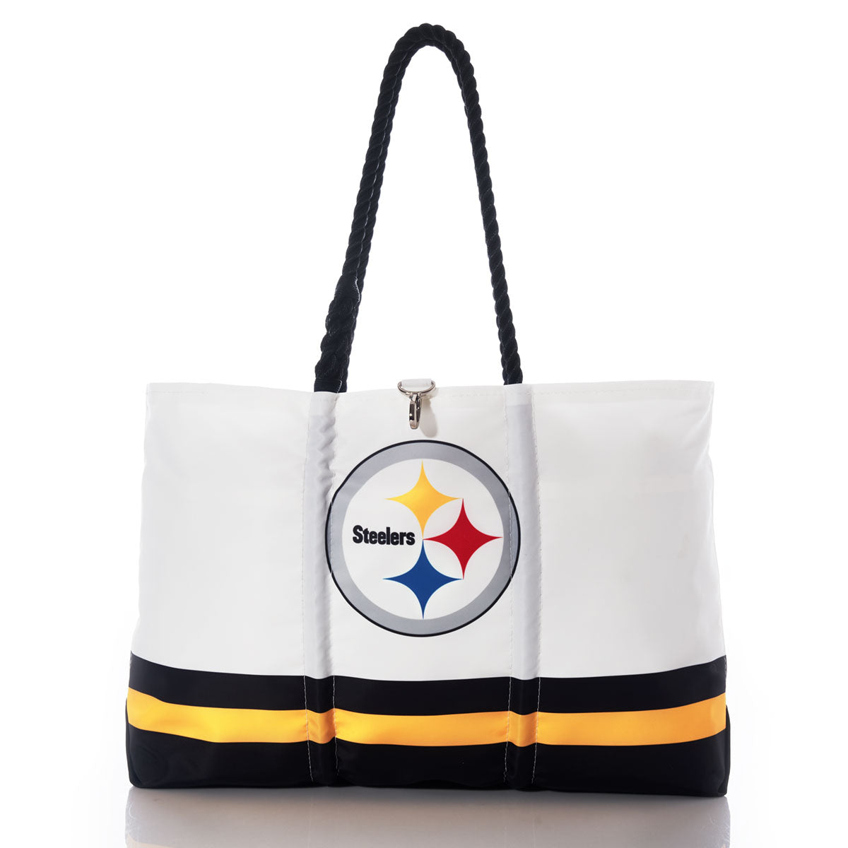 The Sea Bags Pittsburgh Steelers Tailgate Tote, crafted from recycled sail cloth for extra durability, features black handles, the Pittsburgh Steelers logo, and black and yellow stripes near the bottom; this distinctive bag is shown on a reflective surface. by Sea Bags