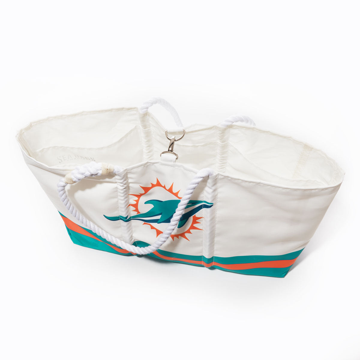 The Sea Bags Miami Dolphins Tailgate Tote is a white bag crafted from recycled sail cloth, featuring sturdy rope handles and adorned with the teams iconic logo plus teal and orange stripes near the bottom—a stylish and eco-friendly choice for devoted fans on game day. by Sea Bags