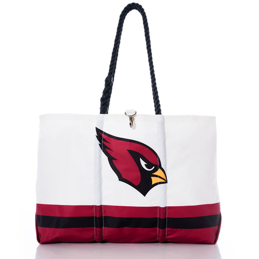 Introducing the Arizona Cardinals Tailgate Tote by Sea Bags—crafted from recycled sail cloth for a unique and eco-friendly design. This white tote features sturdy black rope handles, bold red and black horizontal stripes along the bottom, and showcases a striking red cardinal bird logo, making it the perfect accessory for any fan. by Sea Bags