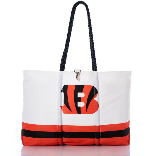 Showcase your team spirit with the Cincinnati Bengals Tailgate Tote from Sea Bags—a stylish white tote crafted from recycled sail cloth for extra durability, featuring black rope handles, bold orange and black stripes, and a distinctive B logo in the center. Perfect for Bengals fans seeking an eco-friendly accessory. by Sea Bags