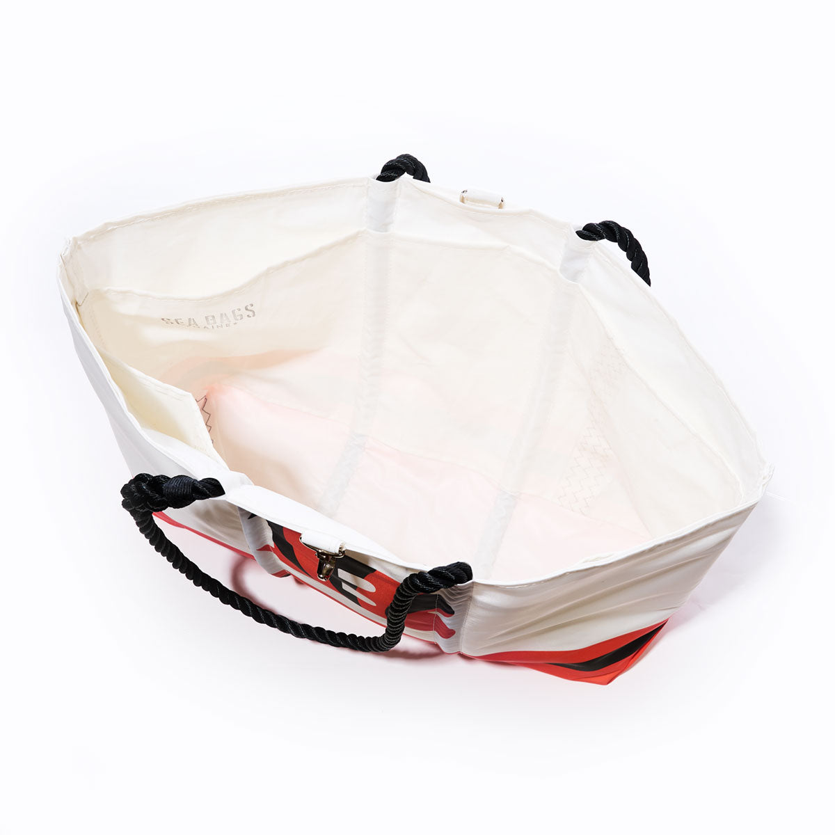 Open Cincinnati Bengals Tailgate Tote by Sea Bags, crafted from recycled sail cloth, featuring black rope handles and bold red accents. The tote appears empty and is viewed from above against a plain white background. by Sea Bags