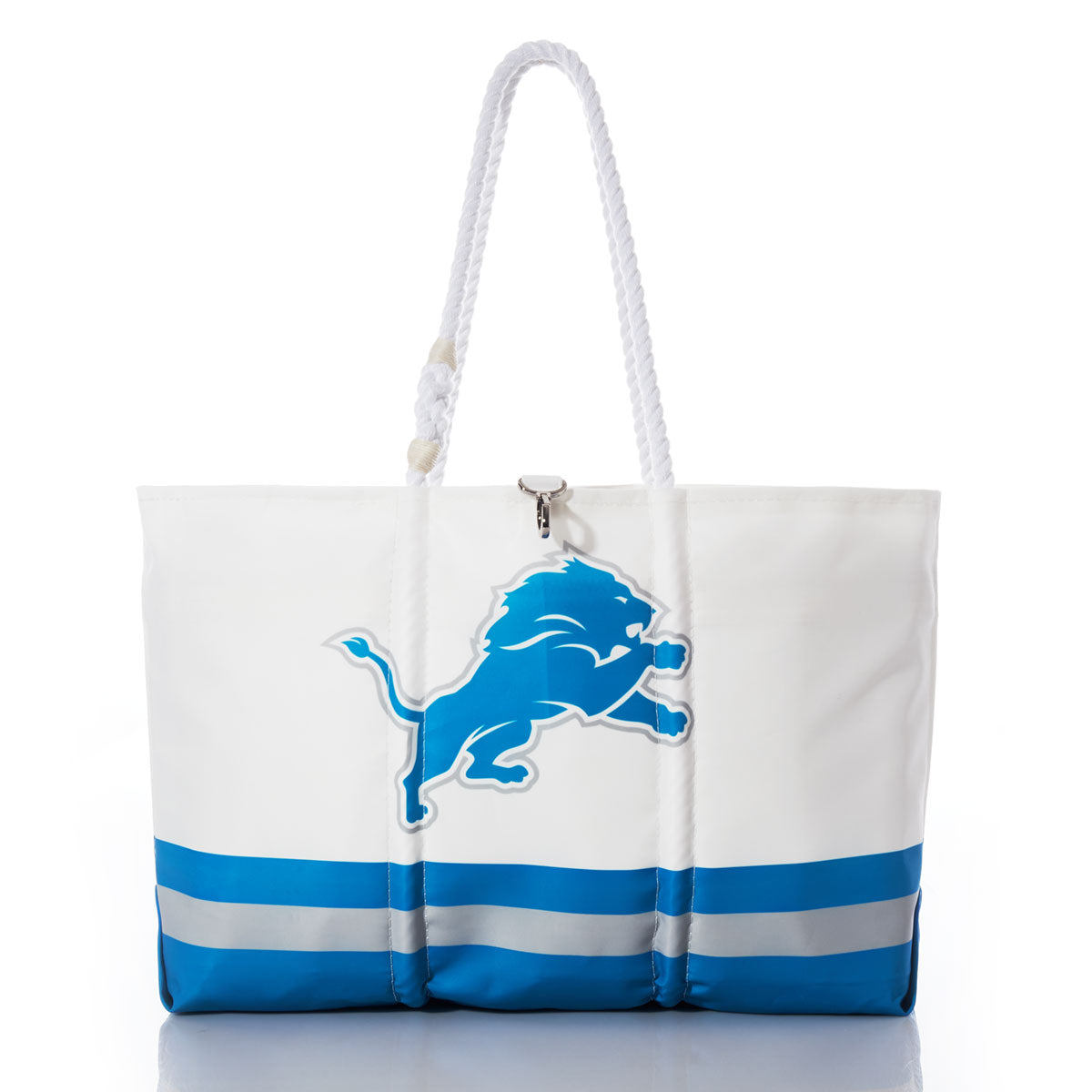 Detroit Lions Tailgate Tote by Sea Bags, featuring bold blue lion branding on the front, white and blue coloring, and sturdy rope handles. Expertly crafted from recycled sail cloth and photographed against a clean white background. by Sea Bags