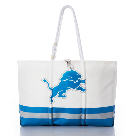 Detroit Lions Tailgate Tote by Sea Bags, featuring bold blue lion branding on the front, white and blue coloring, and sturdy rope handles. Expertly crafted from recycled sail cloth and photographed against a clean white background. by Sea Bags