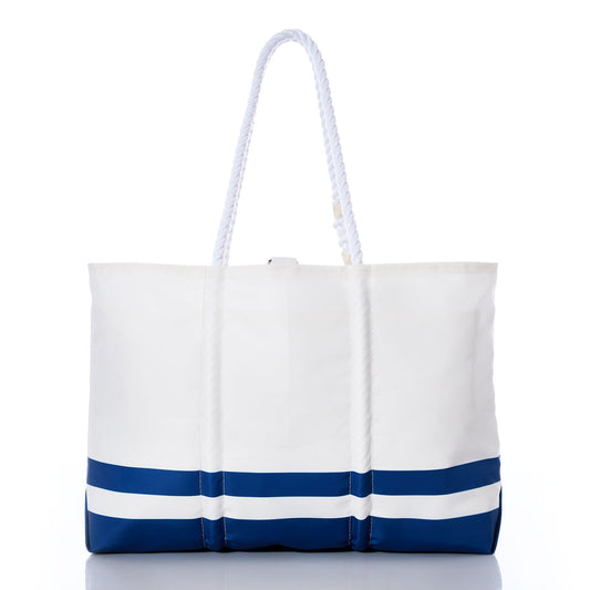 The Sea Bags Indianapolis Colts Tailgate Tote, crafted from white sail cloth with two sturdy white rope handles and featuring two horizontal blue stripes near the bottom, is displayed on a white background—a stylish accessory for any Colts fan. by Sea Bags