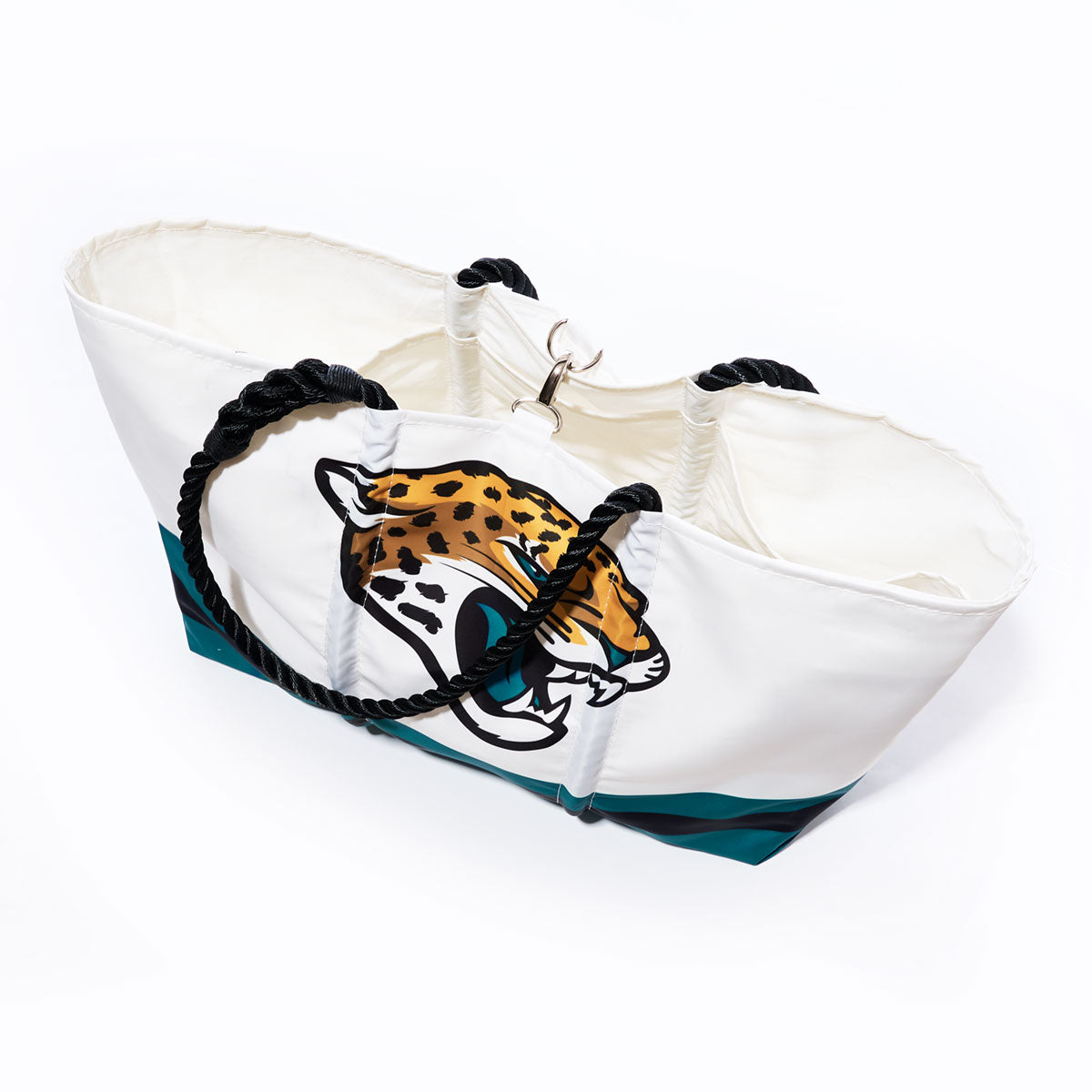 Sea Bags Jacksonville Jaguars Tailgate Tote with black rope handles, crafted from recycled sail cloth, features a large printed Jaguars NFL logo and teal accents on the lower portion, shown on a white background. by Sea Bags