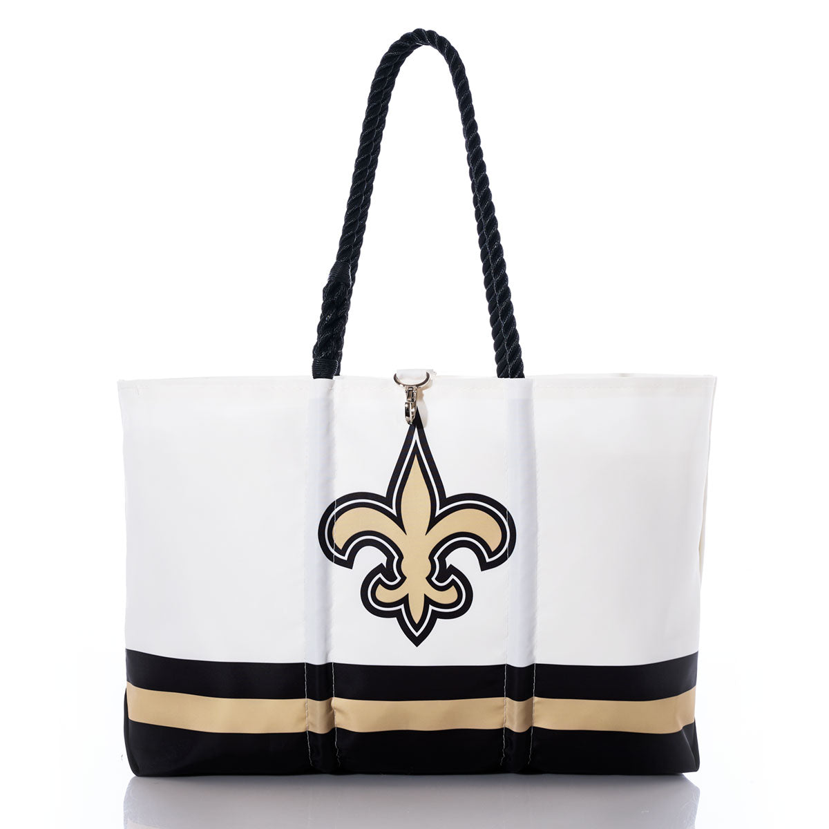Carry your team spirit in style with the Sea Bags New Orleans Saints Tailgate Tote—crafted from durable recycled sail cloth, this white tote features black rope handles, eye-catching gold and black horizontal stripes near the base, and a bold fleur-de-lis symbol on the front, making it the perfect accessory for any Saints fan. by Sea Bags