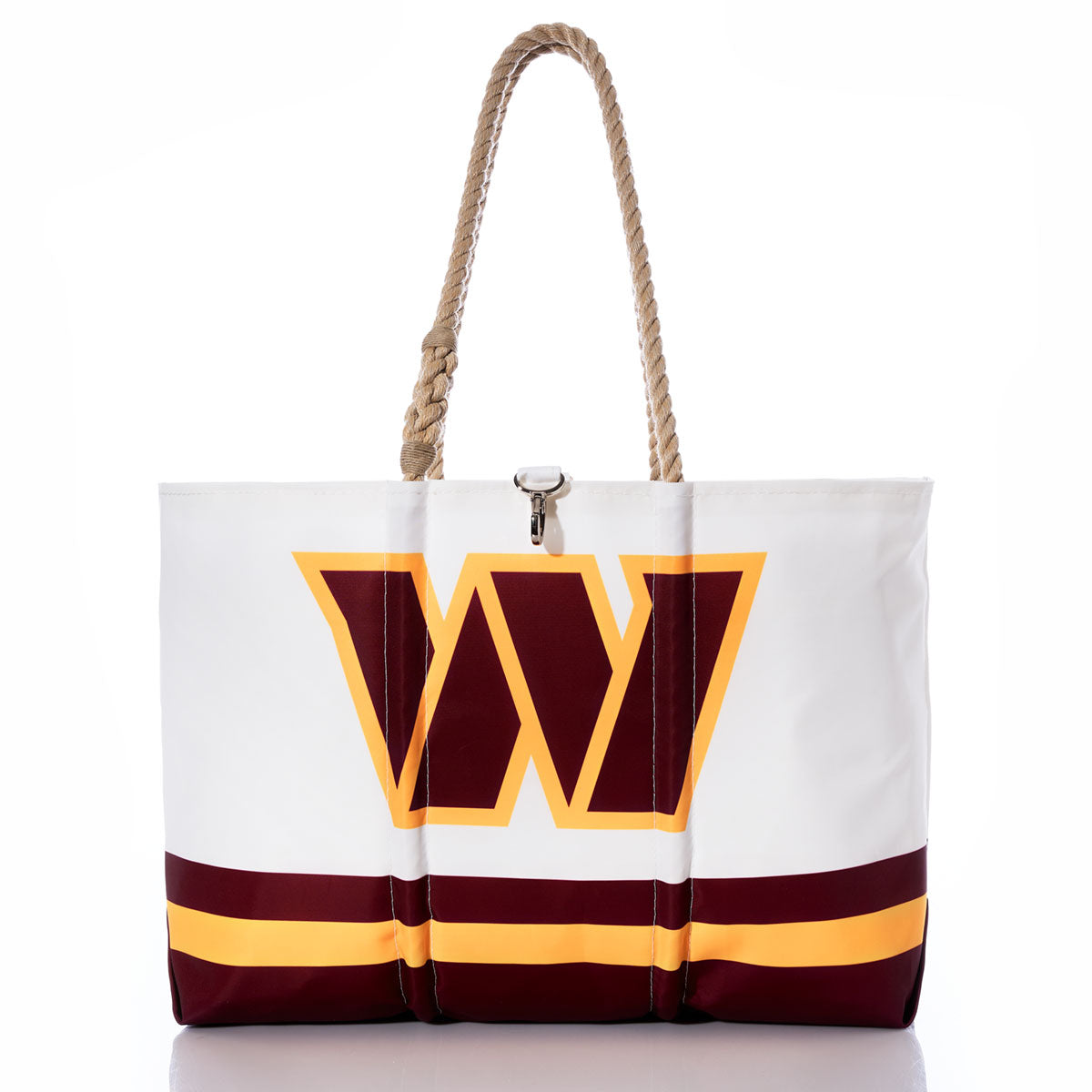 Show your team spirit with the Washington Commanders Tailgate Tote by Sea Bags—a white recycled sail cloth tote featuring thick rope handles, bold maroon and yellow stripes along the bottom, and a striking maroon and yellow W logo on the front. This unique NFL logo bag is ideal for any Washington Commanders fan. by Sea Bags