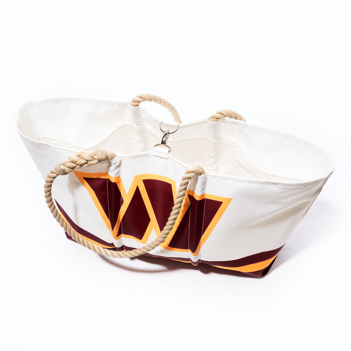 The Sea Bags Washington Commanders Tailgate Tote, crafted from recycled sail cloth and inspired by the team’s colors, features a large maroon W on white, thick twisted rope handles, and is shown on a white background. by Sea Bags