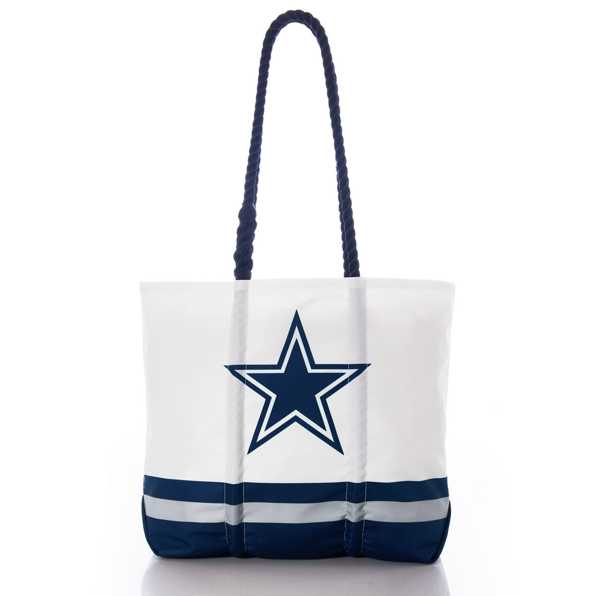 Introducing the Dallas Cowboys Medium Tote by Sea Bags—a durable white tote bag made from recycled sail cloth, featuring navy handles, navy and gray stripes at the bottom, and a prominent navy star outlined in gray on the front—perfect for Dallas Cowboys fans. by Sea Bags