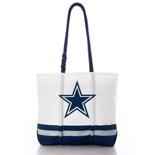 Introducing the Dallas Cowboys Medium Tote by Sea Bags—a durable white tote bag made from recycled sail cloth, featuring navy handles, navy and gray stripes at the bottom, and a prominent navy star outlined in gray on the front—perfect for Dallas Cowboys fans. by Sea Bags