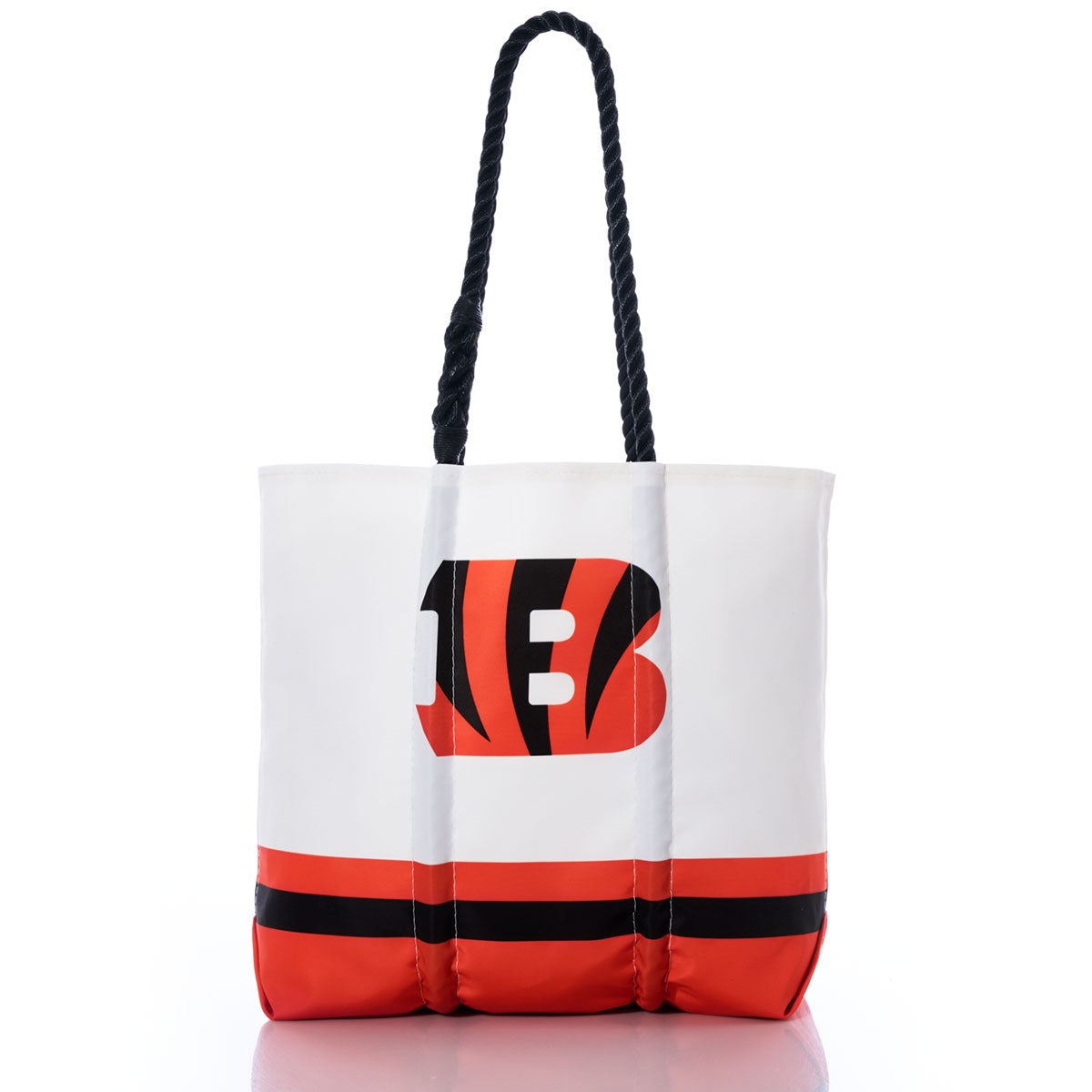 Show off your team pride in sustainable style with the Sea Bags Cincinnati Bengals Medium Tote. Made from recycled sail cloth, this white and orange tote bag features a black rope handle, the Cincinnati Bengals logo on the front, and bold black and orange stripes along the bottom. Perfect for any fan, this eco-friendly tote is both stylish and practical. by Sea Bags