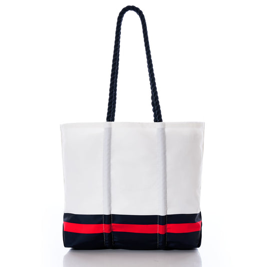 The Houston Texans Medium Tote by Sea Bags is a white tote bag crafted from recycled sail cloth, featuring black rope handles and accented with bold black and red horizontal stripes near the base. Displayed on a plain white background, this stylish accessory is perfect for any Houston Texans fan’s collection. by Sea Bags