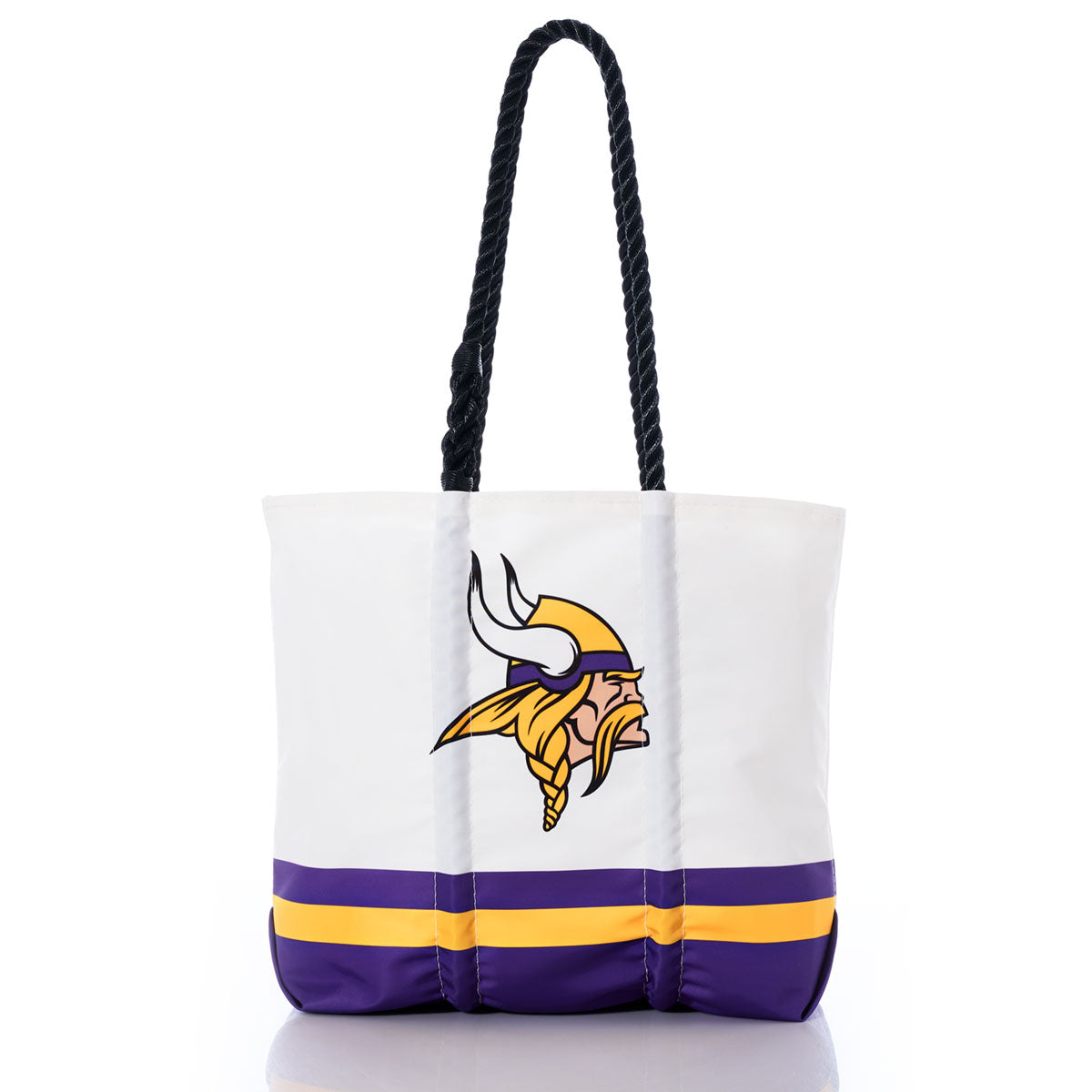 The Minnesota Vikings Medium Tote by Sea Bags is a durable, medium-sized bag crafted from white recycled sail cloth, featuring black handles, purple and gold stripes near the bottom, and the Minnesota Vikings logo—perfect for fans. by Sea Bags