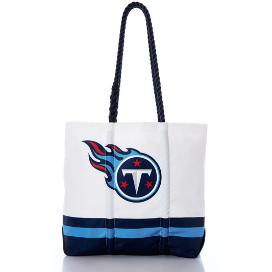 Introducing the Sea Bags Tennessee Titans Medium Tote—crafted from white recycled sail cloth with navy handles and blue stripes, featuring the official team logo prominently on the front. An ideal eco-friendly bag for dedicated Titans fans. by Sea Bags