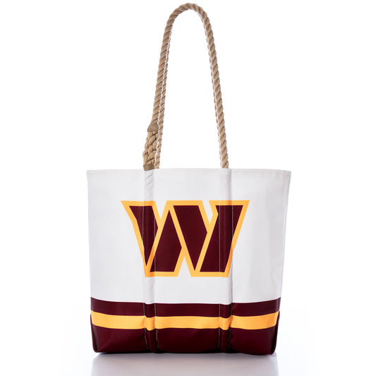 Show your team pride in style with the Washington Commanders Medium Tote from Sea Bags. Crafted from recycled sail cloth for an eco-friendly touch, this white tote features a bold maroon and gold W logo, yellow and maroon stripes along the bottom, and sturdy rope handles. Blending team spirit with sustainable design, it’s the perfect NFL accessory for any fan on the go. by Sea Bags