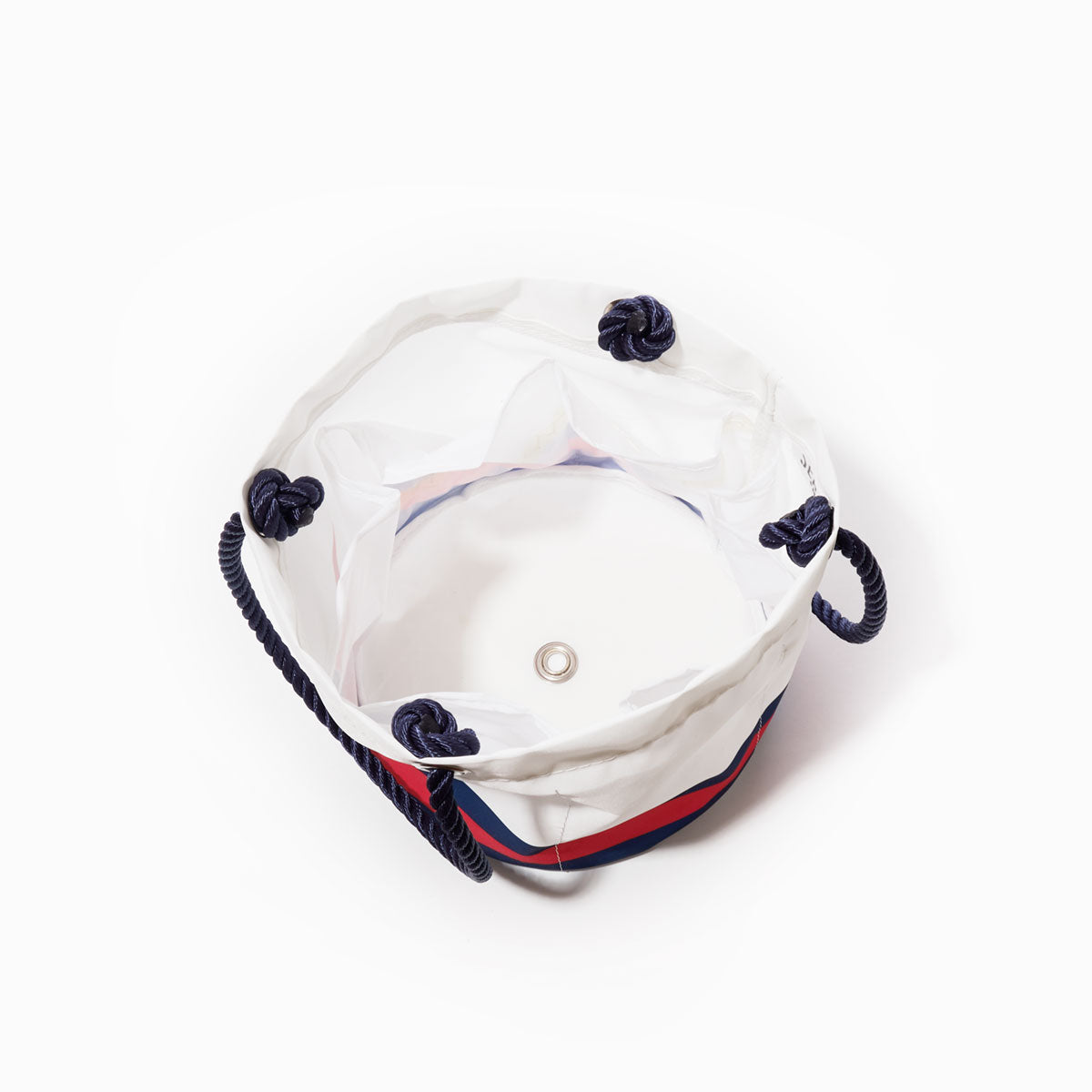 Introducing the Sea Bags New England Patriots Beverage Bucket: a white canvas bucket bag featuring navy rope handles and grommets, inspired by beverage buckets, shown from above with its open, empty interior. by Sea Bags