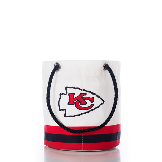 The Kansas City Chiefs Beverage Bucket by Sea Bags is a white bucket bag featuring black rope handles, a bold red and black Kansas City Chiefs logo, and two red and black stripes near the base—all set against a crisp white background for a stylish beverage presentation. by Sea Bags
