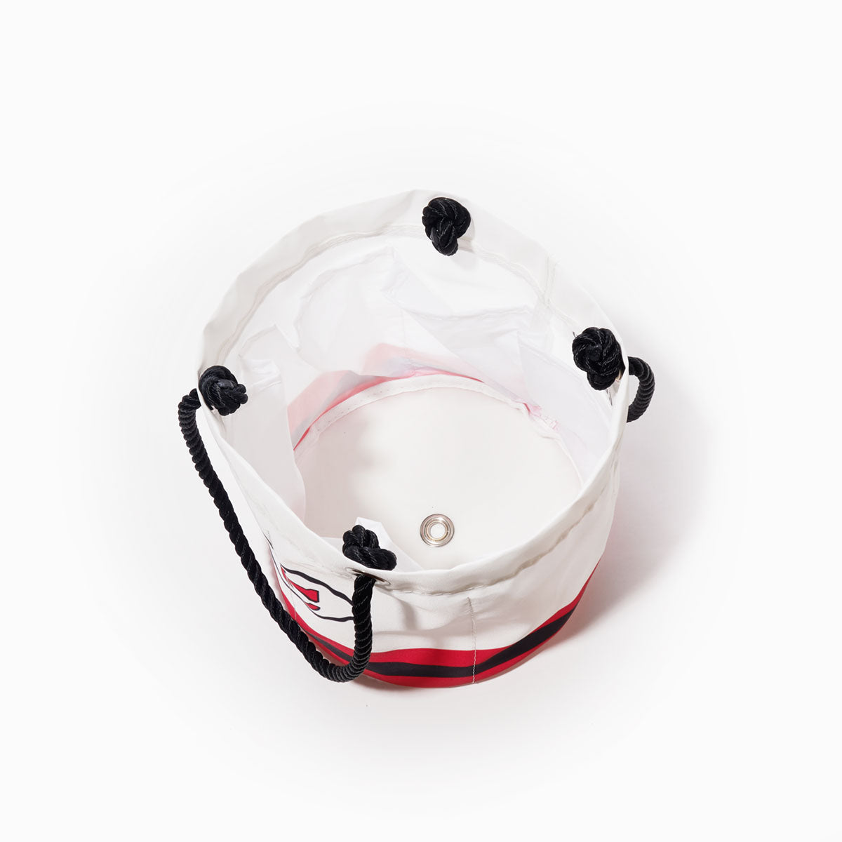 Open Kansas City Chiefs Beverage Bucket by Sea Bags with black rope handles, viewed from above, displaying a metal grommet at the base and a wide, empty interior. by Sea Bags