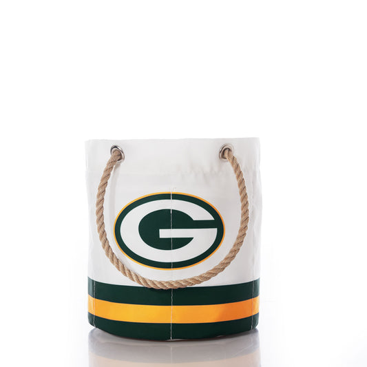Introducing the Green Bay Packers Beverage Bucket by Sea Bags—a white bag with rope handles, adorned with green and gold stripes and a prominent G logo inspired by the iconic football team. This versatile and stylish accessory not only showcases your Packers pride but also doubles as a sustainable cooler or beverage bucket for your next game day gathering. by Sea Bags