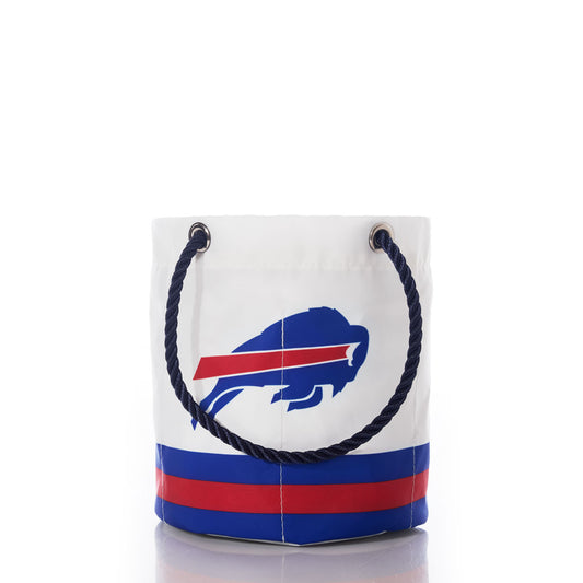 Introducing the Buffalo Bills Beverage Bucket by Sea Bags—a stylish white, bucket-style tote featuring a blue rope handle and adorned with the iconic blue and red Bills logo. With bold horizontal stripes near the base and photographed on a white background, this versatile beverage bucket is perfect for keeping your drinks cool in style wherever you go. by Sea Bags