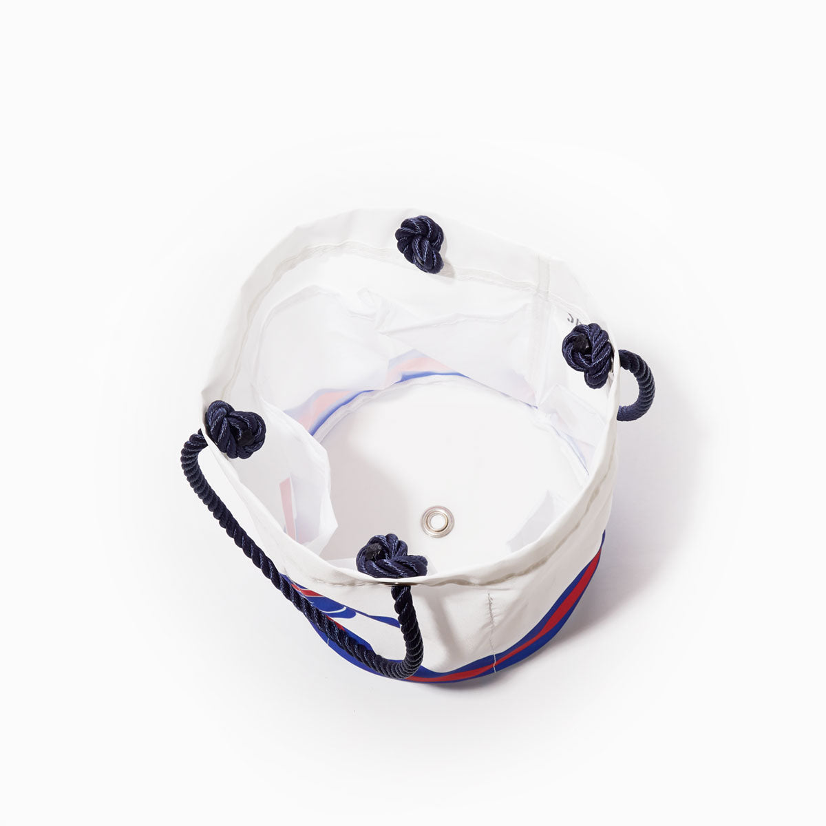 The Sea Bags Buffalo Bills Beverage Bucket—a white fabric bucket featuring navy blue rope handles and a metal grommet at the base—is photographed from above on a white background, offering a stylish alternative to the traditional sustainable cooler. by Sea Bags