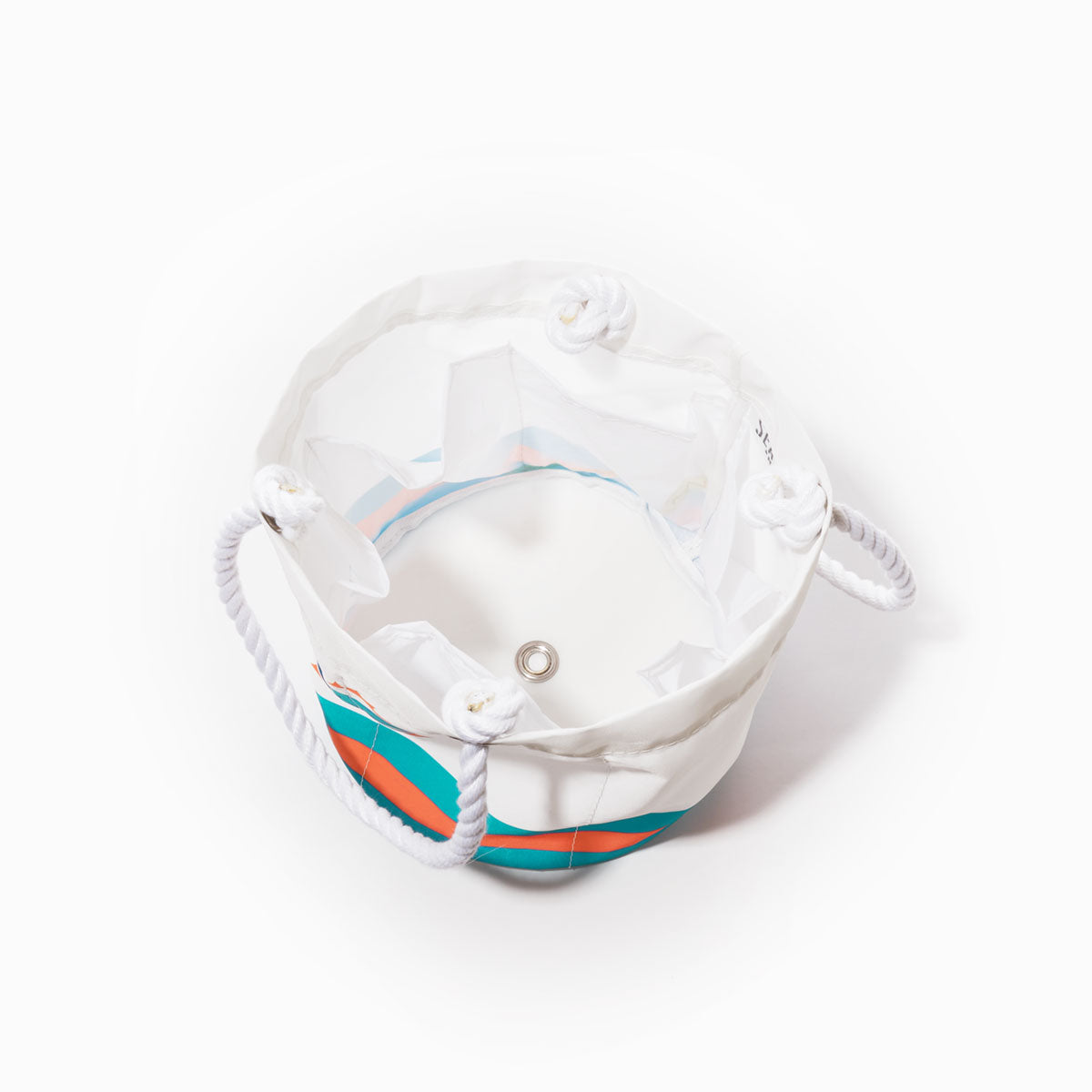 The Miami Dolphins Beverage Bucket by Sea Bags is a white cylindrical tote bag with rope handles, accented by blue and orange stripes. Shown from above on a white background, this stylish and sustainable cooler features a grommet on the bottom and a clear inner pocket—offering both functionality and team pride for your next gathering. by Sea Bags