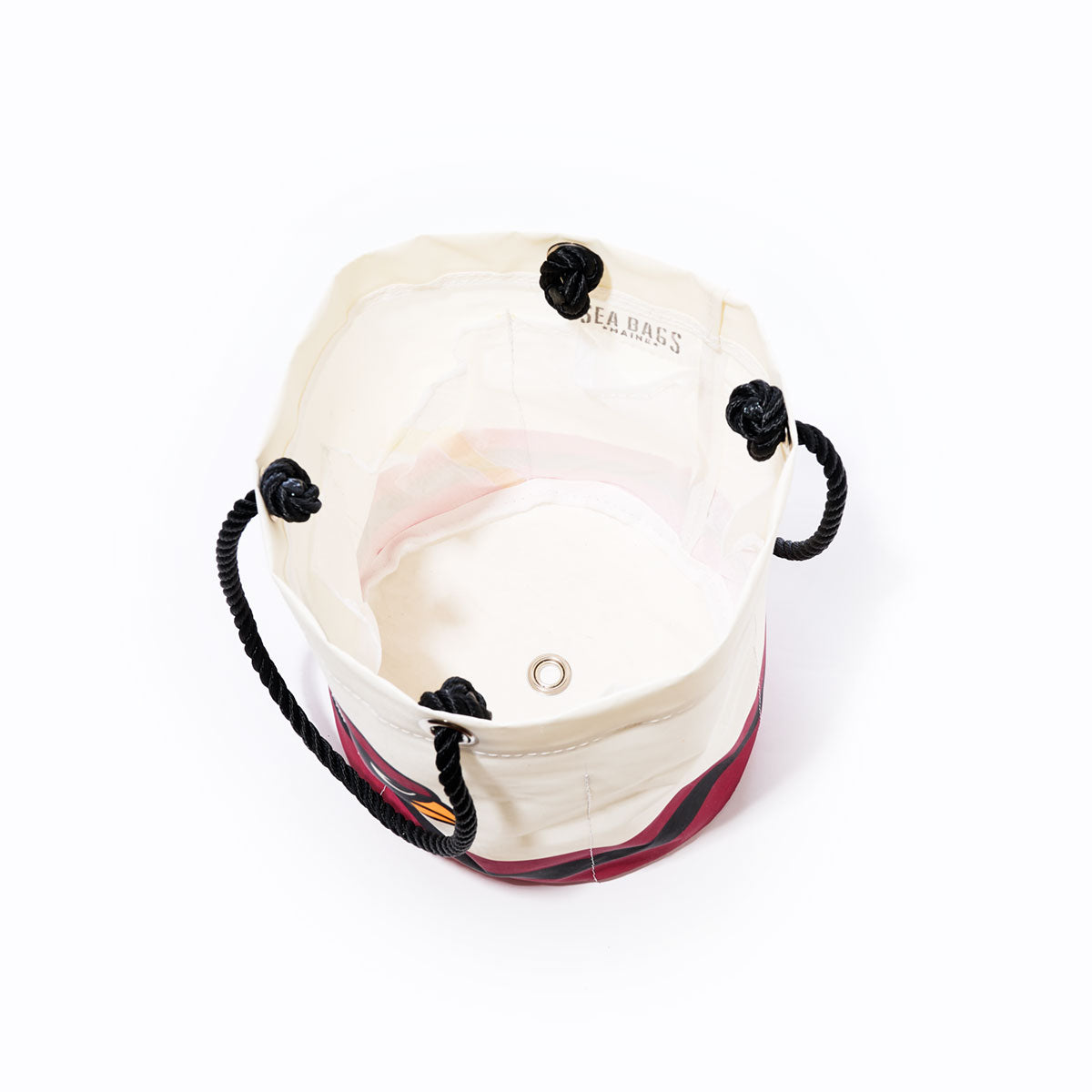 Top view of the Sea Bags Arizona Cardinals Beverage Bucket, a white and red bag with black rope handles and a metal grommet at the bottom, shown on a white background. by Sea Bags