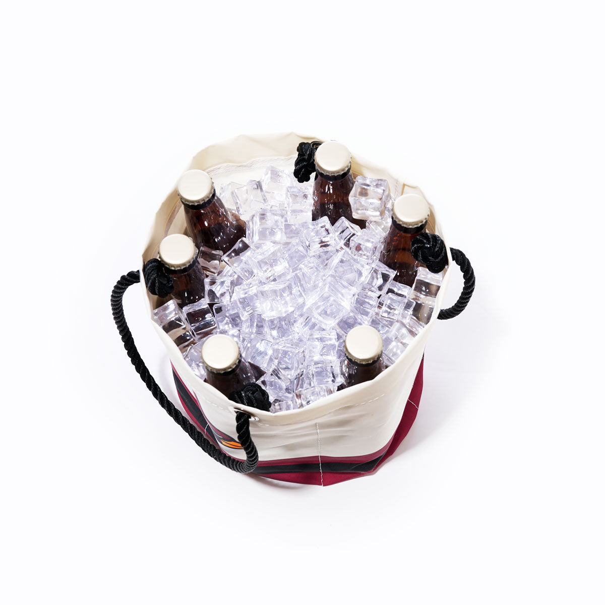Top view of the Sea Bags Arizona Cardinals Beverage Bucket, a sustainable cooler filled with ice cubes and six brown glass bottles with beige caps, set against a white background. by Sea Bags