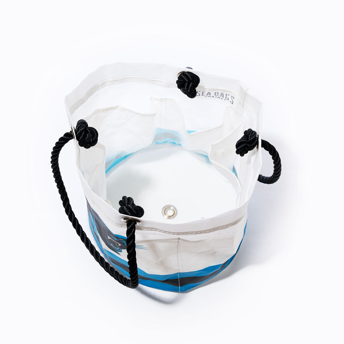 Carolina Panthers Beverage Bucket by Sea Bags, featuring white and blue recycled sail cloth with black rope handles, open top design revealing interior pockets and a metal grommet on the round base, photographed against a white background. by Sea Bags
