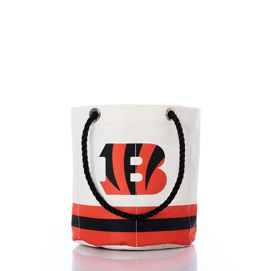 Introducing the Cincinnati Bengals Beverage Bucket by Sea Bags—a white canvas bucket with black rope handles, featuring a bold red and black B logo and stripes at the bottom, perfect for keeping your drinks cold while you cheer on the Bengals. by Sea Bags