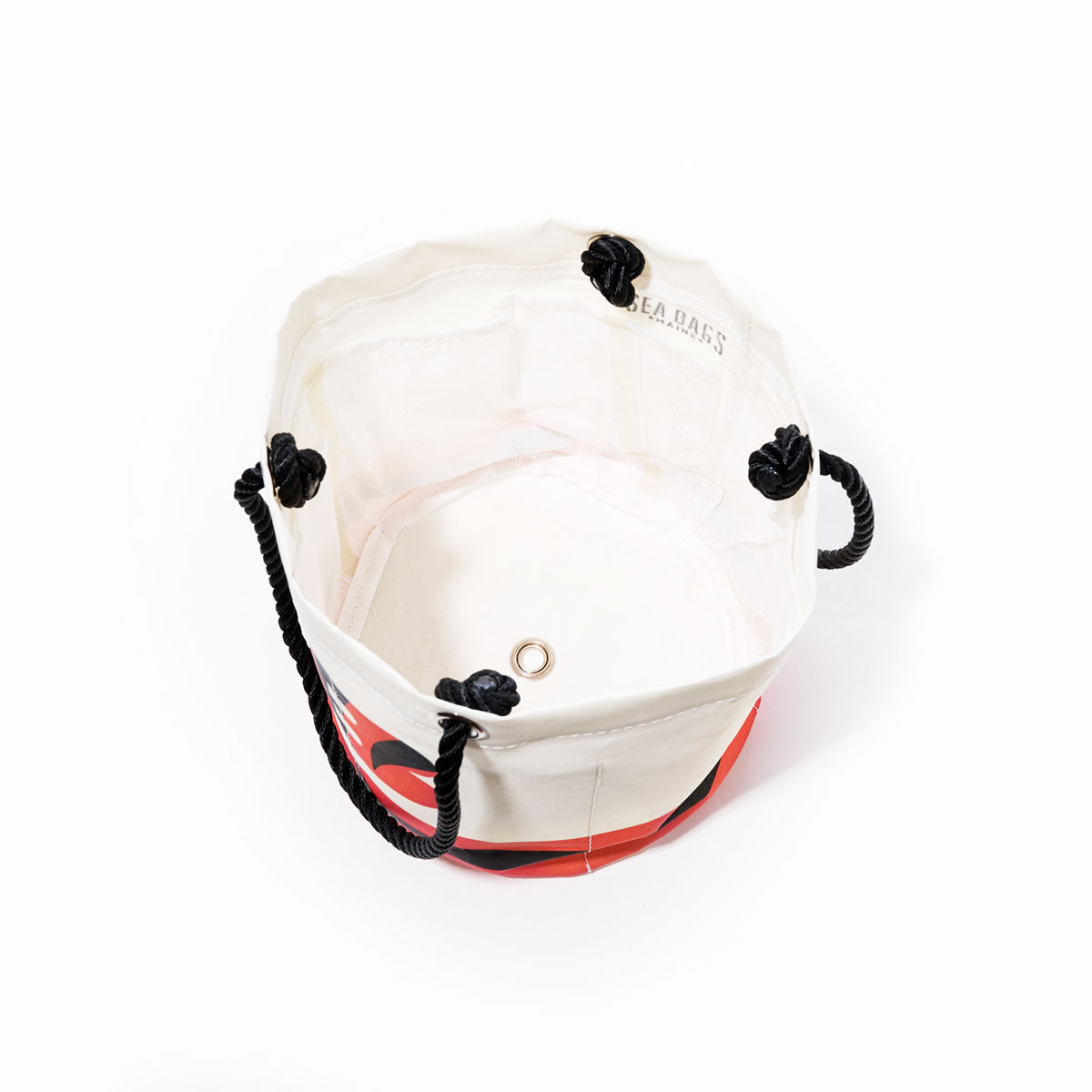 Sea Bags Cincinnati Bengals cylindrical canvas beverage bucket in white and red, featuring black rope handles, viewed from above to reveal the interior and a metal grommet at the bottom. by Sea Bags