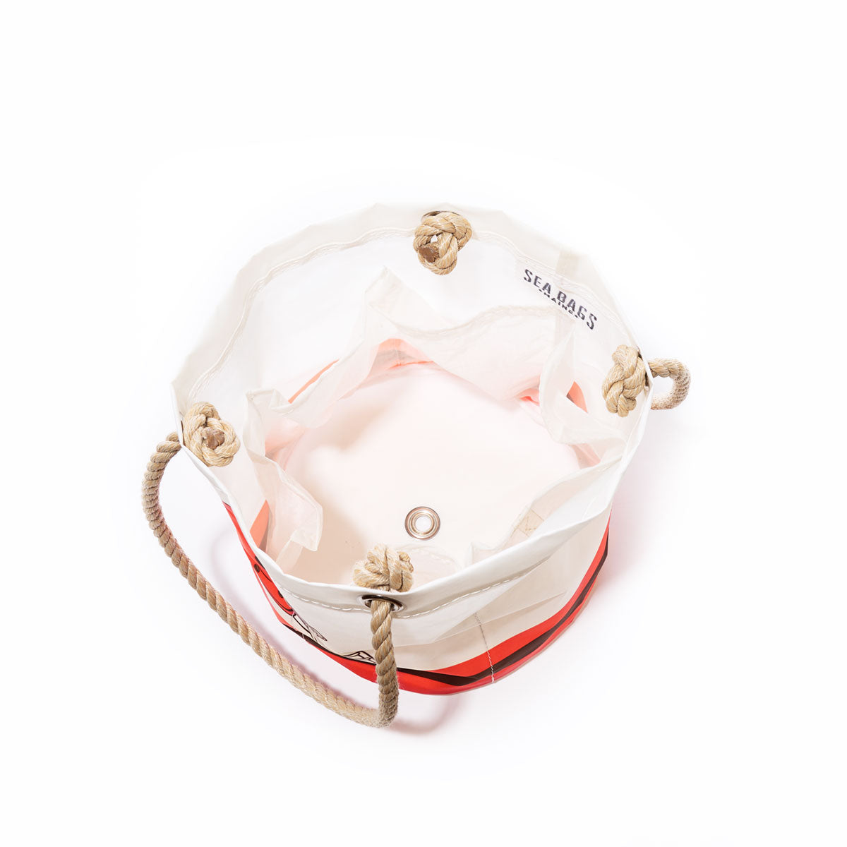 The Sea Bags Cleveland Browns Beverage Bucket is a round canvas tote featuring rope handles with knots, red and black accents, and a metal grommet at the base; seen from above, its roomy interior makes this versatile design perfect as both a sail cloth cooler and a stylish beverage bucket for outings or tailgates. by Sea Bags