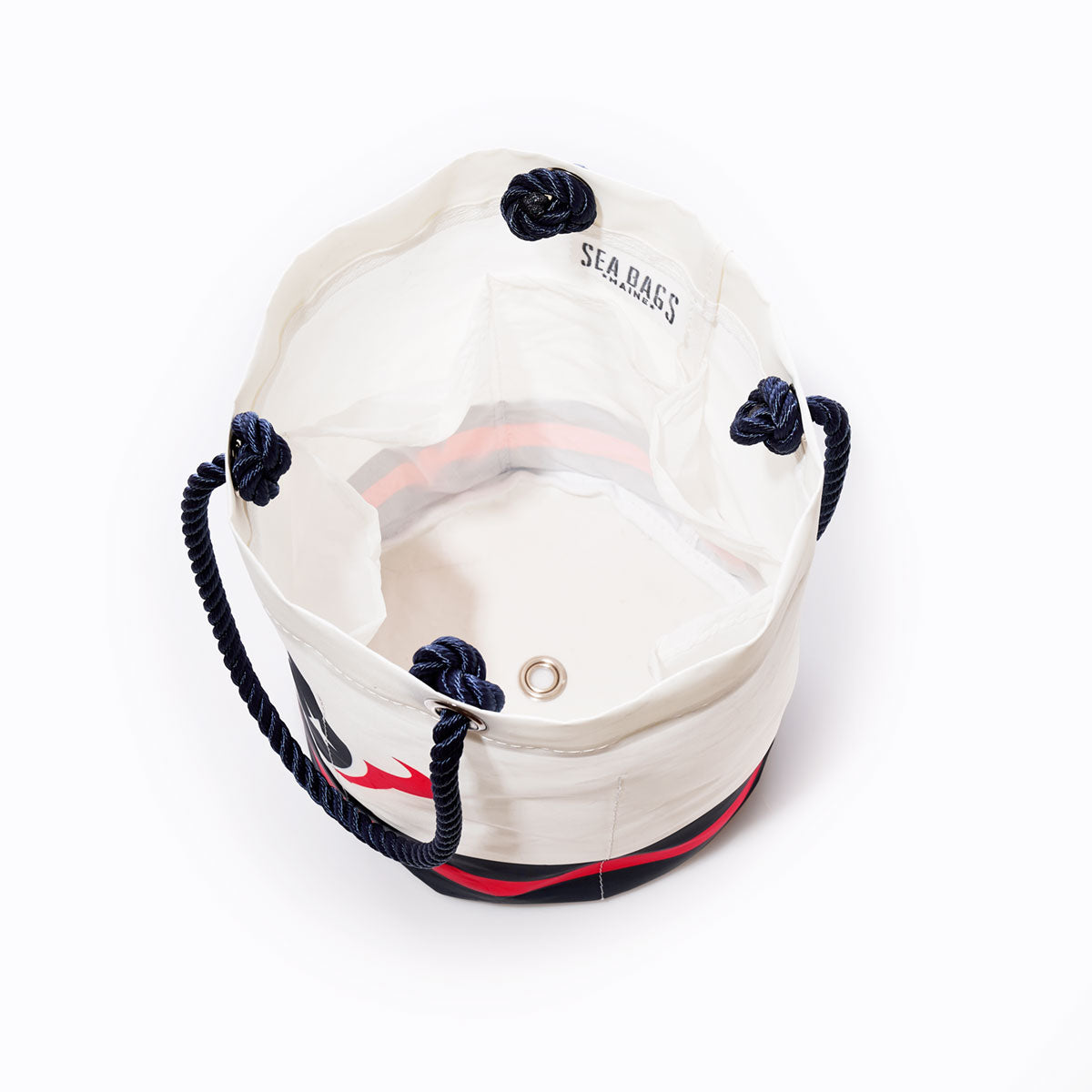 Top view of the Sea Bags Houston Texans Beverage Bucket—a white cylindrical canvas bag with navy rope handles, black and red accents, and SEABAGS printed inside—an eco-friendly cooler perfect for use as a beverage bucket or stylish Houston Texans bag. by Sea Bags