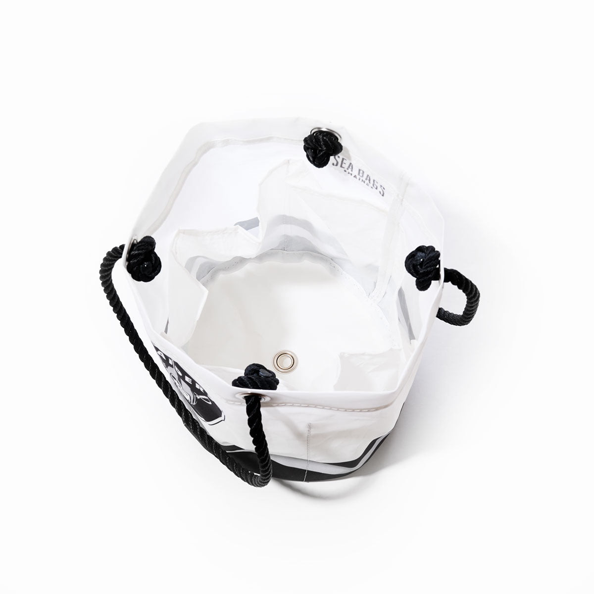 A top view of the Sea Bags Las Vegas Raiders Beverage Bucket showcases its clear hexagonal shape, black rope handles, and a metal grommet at the base, set against a white background. by Sea Bags