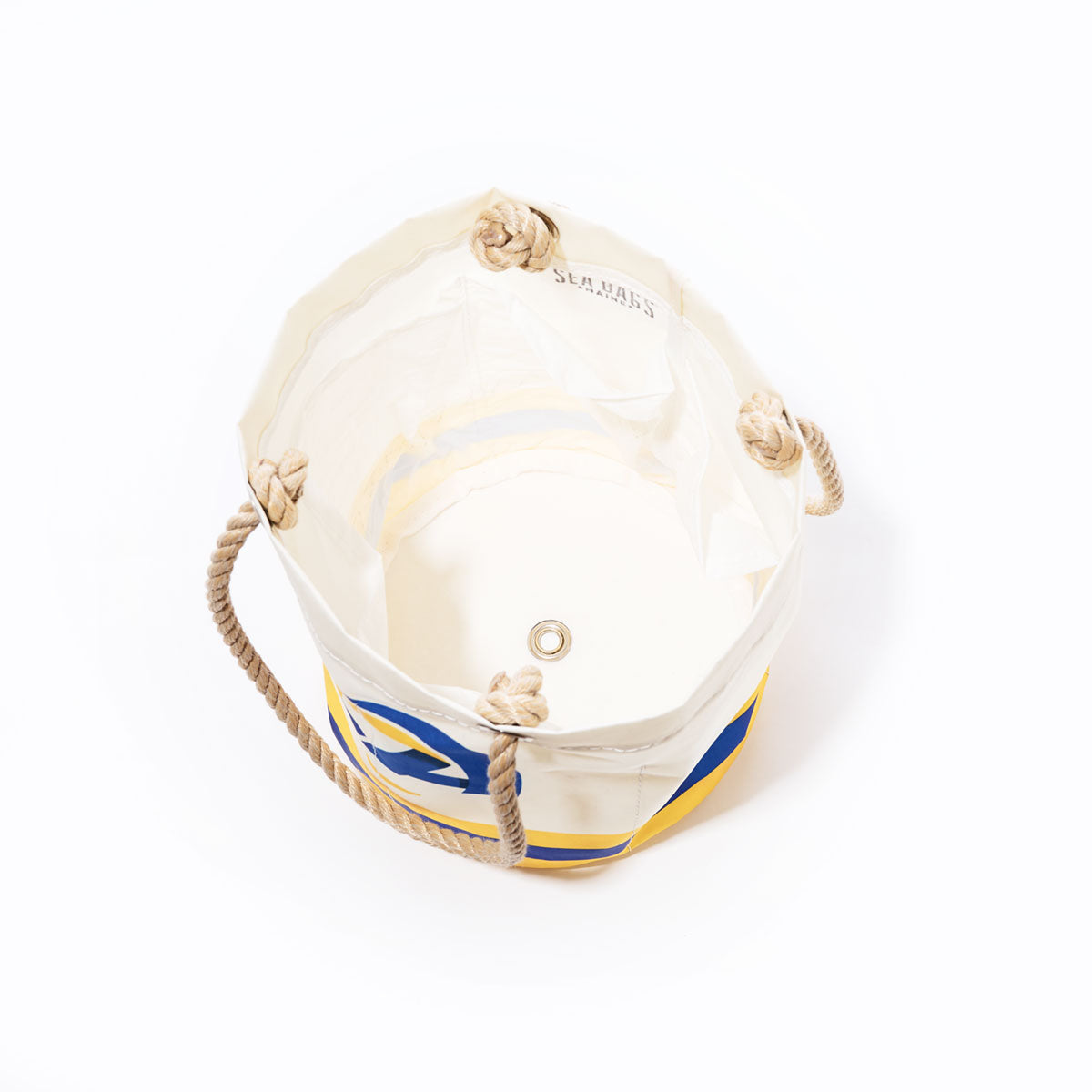 A Los Angeles Rams Beverage Bucket by Sea Bags, crafted from white and yellow sail cloth with rope handles, is shown from above with an empty interior, a metal grommet on the bottom, and is designed as a sustainable cooler. by Sea Bags