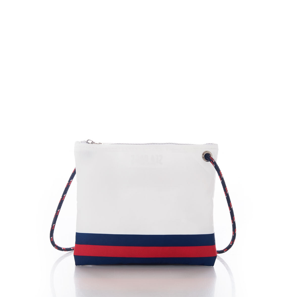 The Sea Bags New England Patriots Slim Crossbody is a sustainable white zippered pouch, crafted from recycled sail cloth, featuring navy and red horizontal stripes at the bottom and a coordinating navy and red rope shoulder strap, shown against a white background. by Sea Bags