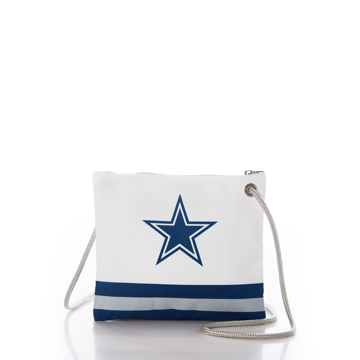 The Sea Bags Dallas Cowboys Slim Crossbody is a white crossbody bag crafted from recycled sail cloth, featuring a distinctive navy blue star logo, blue and gray stripes near the bottom, and a silver rope strap. by Sea Bags