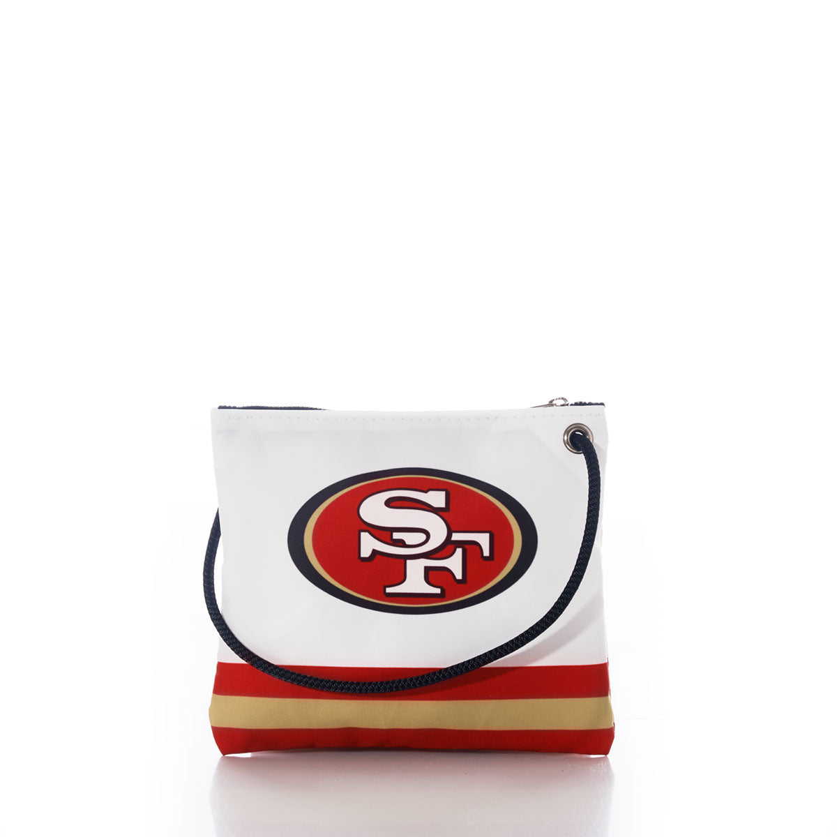 The Sea Bags San Francisco 49ers Slim Crossbody is a white bag crafted from sustainable recycled sail cloth, featuring the team logo, bold red and gold stripes at the bottom, and a navy blue rope handle. It is shown on a plain white background. by Sea Bags