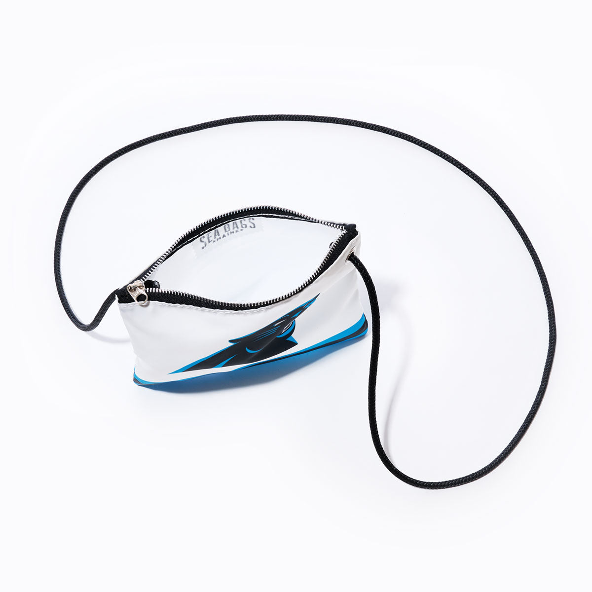 Introducing the Carolina Panthers Slim Crossbody by Sea Bags—a sleek, white zippered pouch made from recycled sail cloth, showcasing the iconic blue and black Carolina Panthers logo on a white background with a slender black cord strap. This accessory is perfect for fans looking for a unique and sustainable Carolina Panthers bag. by Sea Bags