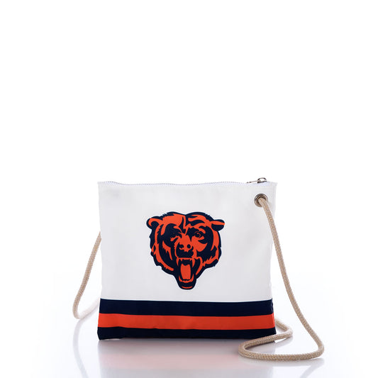 Introducing the Sea Bags Chicago Bears Slim Crossbody, a white crossbody bag crafted from recycled sail cloth. It features a rope strap, two horizontal stripes at the bottom, and showcases a bold navy and orange bear logo reminiscent of a classic Chicago Bears bag. by Sea Bags