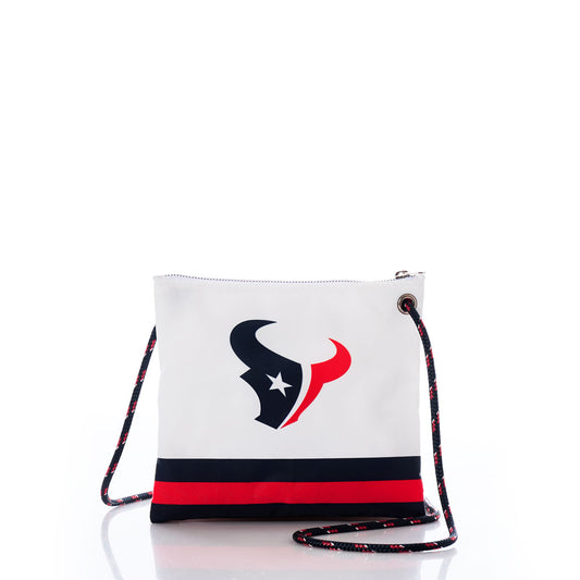 The Houston Texans Slim Crossbody by Sea Bags is crafted from recycled sail cloth and features a bold team logo, navy and red stripes along the bottom, and a sturdy rope strap in coordinating team colors—all showcased against a crisp white background. by Sea Bags
