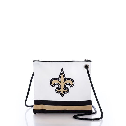 The New Orleans Saints Slim Crossbody by Sea Bags is a white crossbody bag made from recycled sail cloth, adorned with a striking black and gold fleur-de-lis emblem inspired by the iconic New Orleans Saints. It features a stylish black and gold stripe along the bottom and comes with a coordinating black strap. by Sea Bags