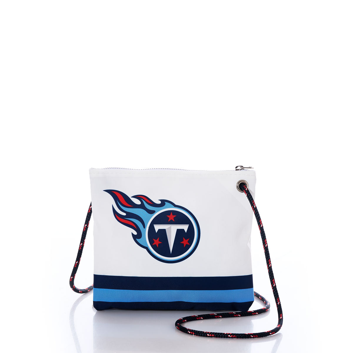 Introducing the Tennessee Titans Slim Crossbody from Sea Bags—a sustainable white crossbody bag made from recycled sail cloth, featuring the Tennessee Titans football team logo. Designed with a bold blue stripe near the bottom and finished with a black and blue striped strap, this eco-friendly accessory is perfect for any Titans NFL fan. by Sea Bags