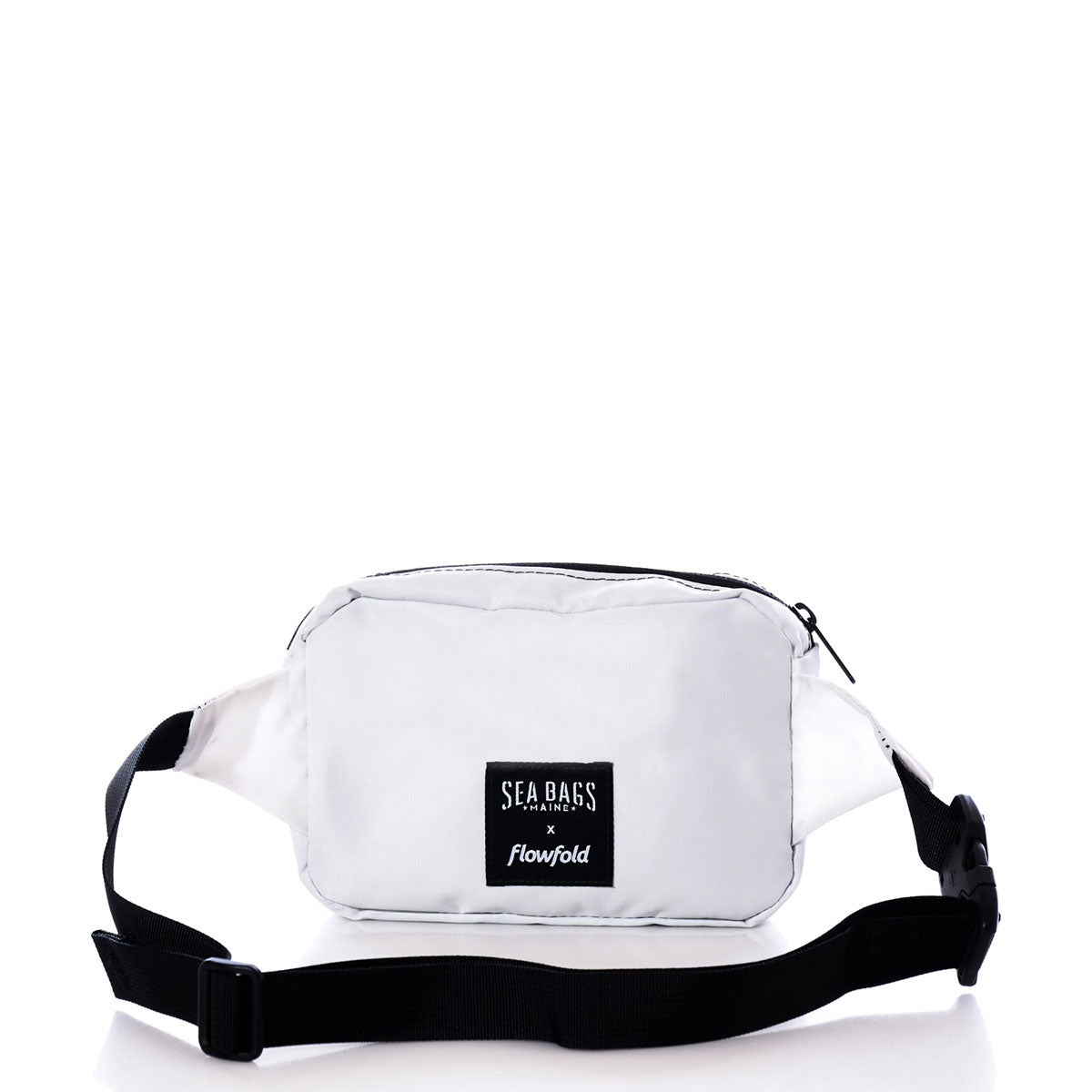 The Octopus Belt Bag by Sea Bags is a small white waist bag made from recycled sail cloth, featuring a black adjustable strap and a front label that reads Sea Bags x Flowfold. Shown against a white background, it’s the perfect belt bag for carrying your travel essentials. by Sea Bags