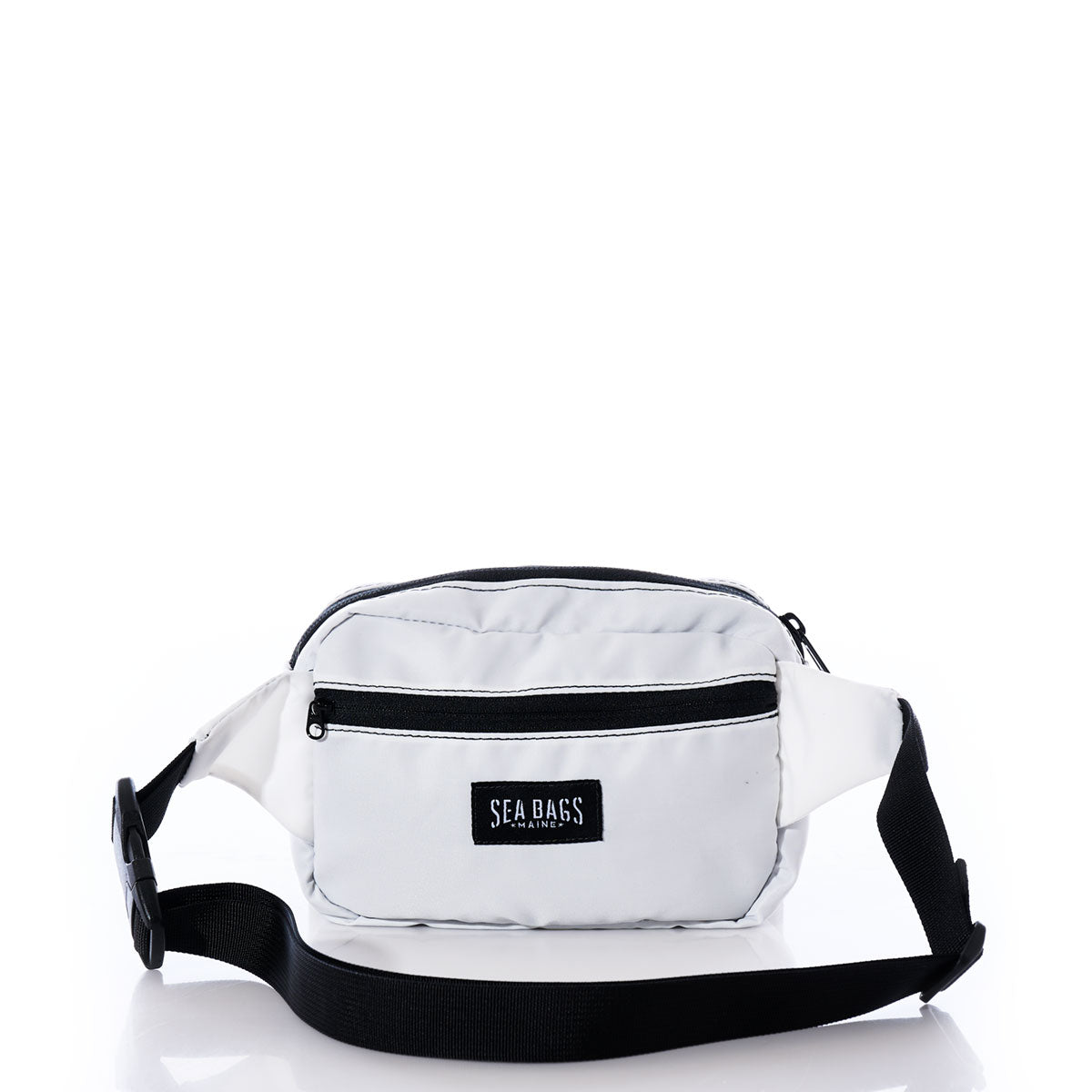 Miami Dolphins Belt Bag by Sea Bags, crafted from recycled sail cloth and designed with black zippers and a black adjustable strap. The sustainable white belt bag features a front pocket adorned with the Sea Bags logo patch, shown against a white background. by Sea Bags