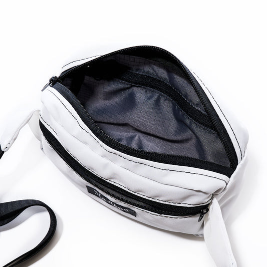 Sea Bags Miami Dolphins Belt Bag crafted from recycled sail cloth, featuring a front zipper pocket and an open main compartment, shown from above on a white background—a stylish and sustainable accessory choice. by Sea Bags