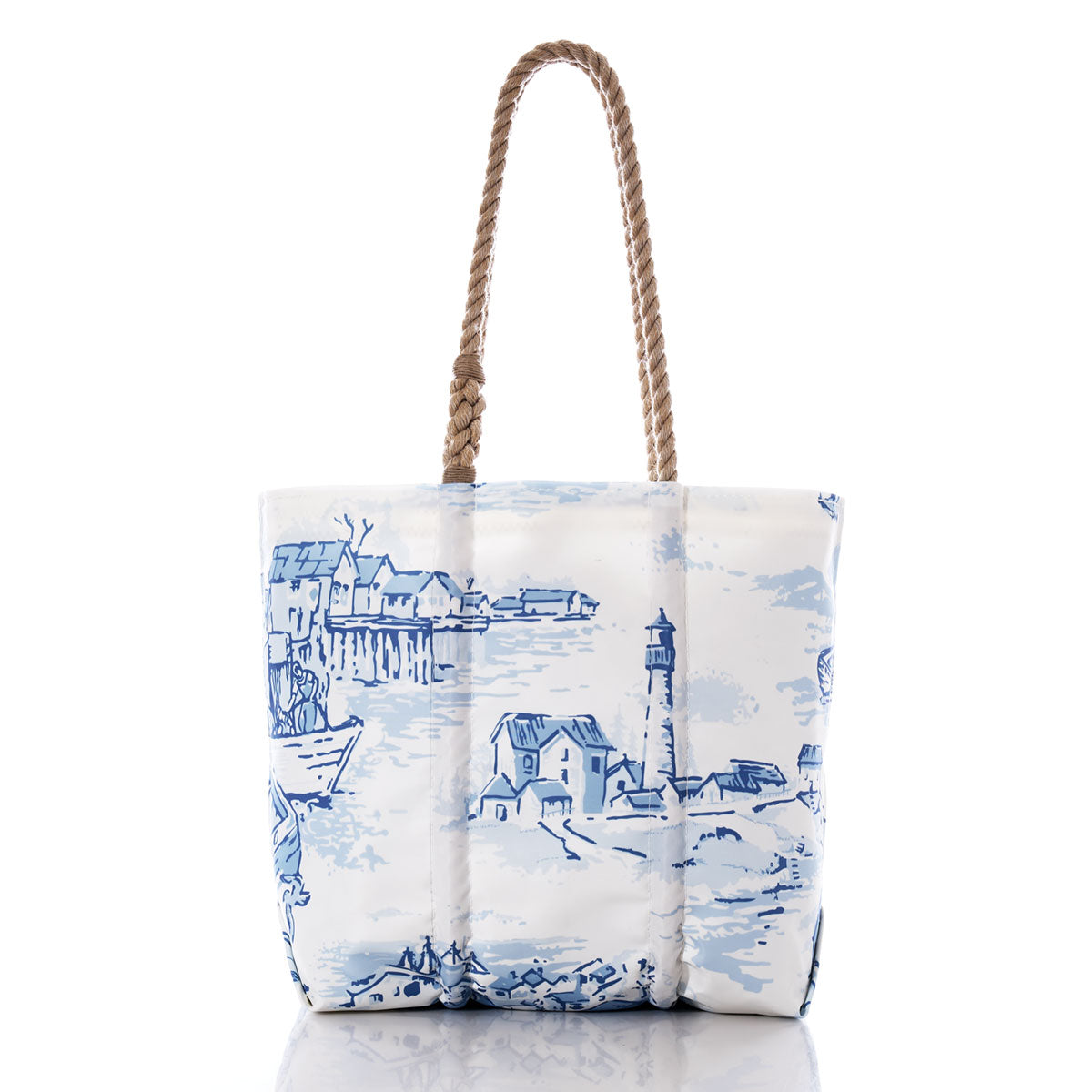 Sea Bags’ Maine Fishing Village Medium Tote is crafted from recycled sail cloth and features a sturdy rope handle. This white tote bag is adorned with blue prints of a lighthouse, boats, and houses, capturing the charm of a Maine coastal fishing village. by Sea Bags